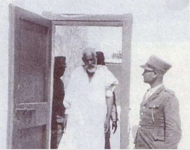 Omar Mukhtar entering the court room.