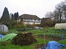 The surviving building of the former Dominican priory established in 1308 by Edward II, next to the Royal Palace of Kings Langley. The Priory and allotments, Kings Langley (geograph 2310899).jpg