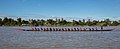 Thirty-five rowers on a long racing pirogue in Laos.jpg
