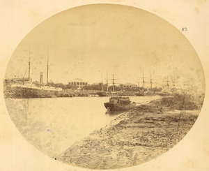 Western ships anchored alongside the European concessions in 1874 Tianjin, with Western Ships in Hai River and Grand, Colonnaded Western Building on the River Bank. China, 1874 WDL2109.png