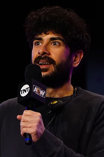 Tony Khan speaking at an AEW show in December 2021