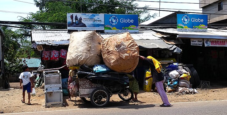 A tricycle that gets heavily overloaded, Palawan, Puerto Princesa City in the Philippines.