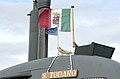 US Navy 080916-N-8467N-003 Adm. Paolo La Rosa adjusts the Italian flag while taking a tour of Italian submarine ITS Salvatore Todaro (S 526).jpg