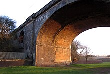 View underneath one of the arches; the divide between the old and new structures is clearly visible. Underneath the arch - geograph.org.uk - 2831363.jpg