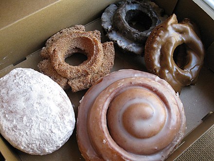 A box of doughnuts. Doughnuts are a popular morning snack in America, especially among workers.