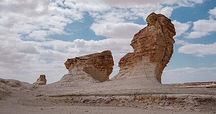 This shows some stone formations in Wadi Dahek. It is a bit like Wadi Rum in white.