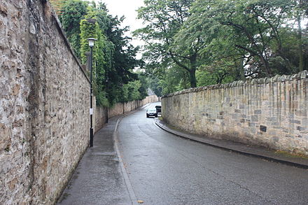 The western section of Inveresk Village is typified by high stone walls and mansion-houses screened by trees