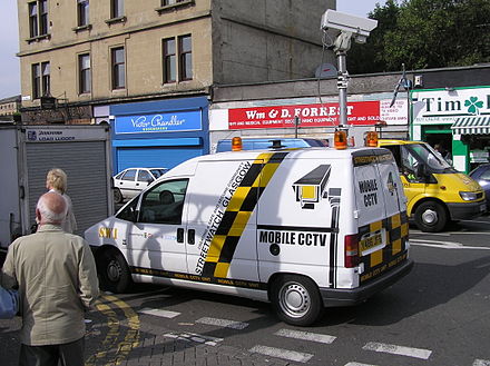 A mobile closed-circuit TV van monitoring a street market