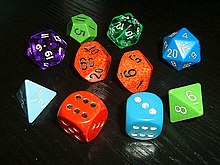 Typical role-playing dice, showing a variety of colors and styles. Note the older hand-inked green 12-sided die (showing an 11), manufactured before pre-inked dice were common. Many players collect or acquire a large number of mixed and unmatching dice. Wuerfel5.jpg