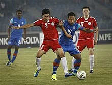 Lalpekhlua (No 10) in action against Afghanistan in 2011 Zohib Islam Amiri (in red uniform) vs Jeje Lalpekhlua (in blue uniform).jpg