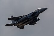 An F-15E Strike Eagle, tail number 91-0313, taking off from RAF Lakenheath in England. The aircraft is assigned to the 494th Fighter Squadron.