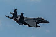 An F-15E Strike Eagle, tail number 91-0313, taking off from RAF Lakenheath in England. The aircraft is assigned to the 494th Fighter Squadron.