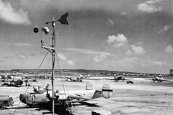 Ramp at East Field, fall 1944. Consolidated B-24J-105-CO Liberator 42-109809 "Evasive Action" 819th Bomb Squadron from the 30th Bomb Group, C-47 Skytr