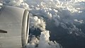 A view of plane propeller and clouds from window.jpg