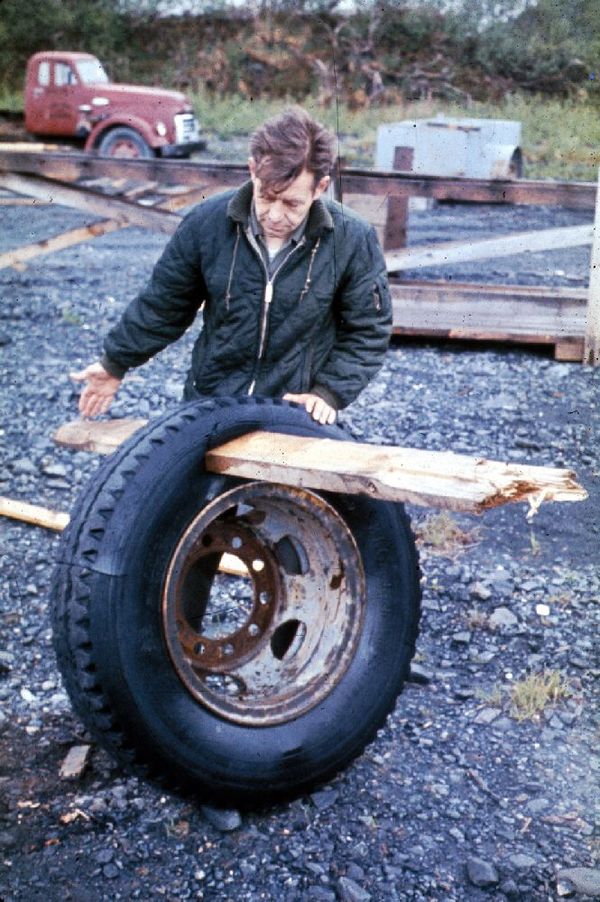 A plank driven through a tire by the tsunami in Whittier