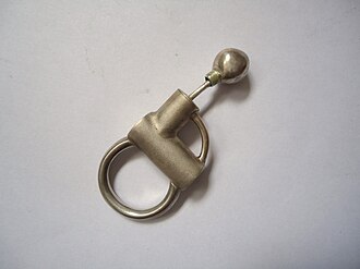 Example of a silver ring with architectonic influence, particularly the use of texture and the kinetic element at the top of the item. Architectonic silver ring.jpg