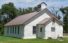 One-story building with flat roof, large steeple