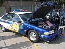 Berkley's Custom Police Cruiser, a 1991 Chevrolet Caprice complete with a 502-CID V8 and flames, donated by a group of residents for use in the Woodward Dream Cruise. Berkley Custom Cop Car.jpg