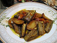 Badenjan (eggplant) is usually served for lunch as a light meal or as a side dish. It tastes best with freshly baked bread along with sour minted yogurt. Shomleh/shlombeh (a cold drink made of yogurt that is sprinkled with fresh or dried mint). Bonjon or Bonjorn.jpg