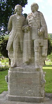 Georg Anton Boxberger (links) mit Balthasar Neumann (Boxberger-Neumann-Denkmal von 1938 im Rosengarten, Bad Kissingen)