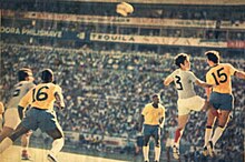 Fontana (yellow 15) and Everaldo (yellow 16) of Brazil playing against Nicolae Lupescu (white 3) and Alexandru Neagu (white 16) of Romania. Brasil vs Rumania 1970.jpg