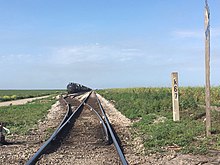 Buker passing track located at milepost K 67 between South Bay and Lake Harbor. It's used for storage and for Bryant Turn trains to pass each other. Buker Passing Track.jpg