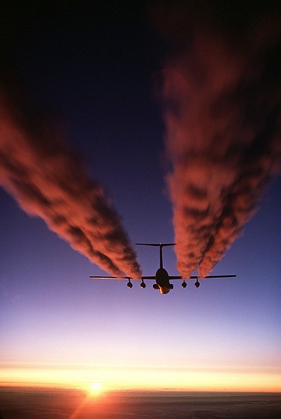 TF33s of a C-141 Starlifter leave contrails over Antarctica