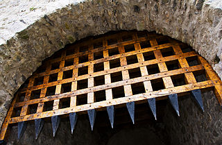 <span class="mw-page-title-main">Portcullis</span> Heavy vertically-closing gate typically found in medieval fortifications