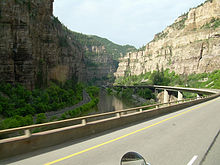 A railroad, river and two-tiered highway following a narrow canyon