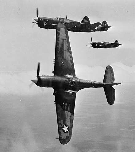 In the vicinity of Moore Field, Texas. The lead ship in a formation of P-40s is peeling off for the "attack" in a practice flight at the US Army Air Forces advanced flying school. Selected aviation cadets were given transition training in these fighters before receiving their pilot's wings, 1943.