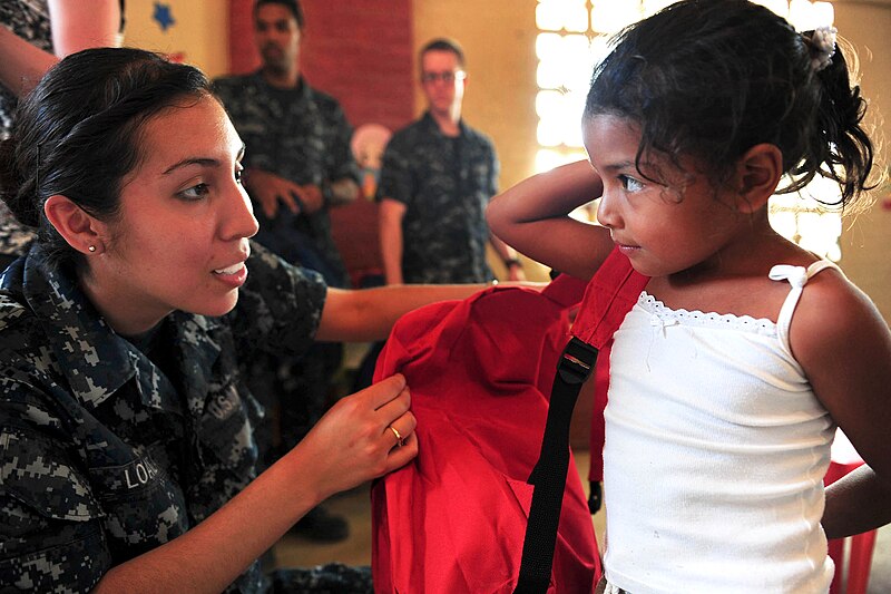 File:Defense.gov News Photo 110520-N-QD416-443 - U.S. Navy Seaman Arianna Loaiza helps a student put on a donated backpack during a Continuing Promise 2011 community service event in Santa Rosa.jpg