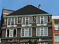 Sculptures at the front of the building "De Standaard" in Amsterdam. Built around 1917 by architect Jac. Duncker.