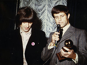 Don Grierson (right) accepting the Golden Apple Award from George Harrison