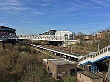 Footbridge over Drayton Park station, from Bryantwood Road in 2018. Drayton Park railway station (2018).jpg