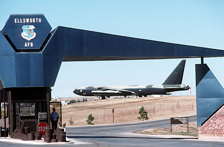 Ellsworth AFB Main Gate with a B-52D on static display in the background, c.1988