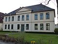 District court with a row of linden trees on the street side