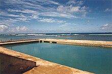 Salt water swimming pool in the interior of the Natatorium Ewa Seawall--Waikiki Natatorium War Memorial near Kaimana Beach.jpg
