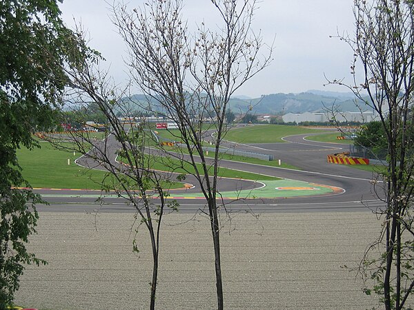 Turn 12 (and 6 to the right) of the Fiorano Circuit as seen from the roadside.