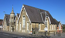 The British School on Bridge Street was founded by Meadrow Chapel. Former British School, Bridge Street, Godalming (April 2015).JPG
