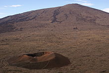 Parasitic cone (in foreground) with larger main cone in background, at Piton de la Fournaise volcano on the island of Reunion FormicaLeo & PitonDeLaFournaise 2.jpg