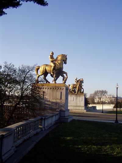 looking north at statues of horses on pedestals