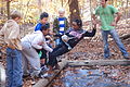 "Peanut Butter Pit" Challenge where kids had to get out of reach rope without using branches or throwing stuff at it. Than use the rope to swing accross the "Peanut Butter Pit". As with other Hemlock Overlook challenges, the success was a result of a planning and executing a strategy that required working as a team. }}