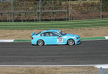 Okyay driving the Borusan Otomotiv Motorsport BMW 320si at Imola during the 2008 World Touring Car Championship season. Ibrahim Okyay WTCC Imola 2008.jpg