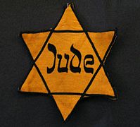 Jews in Nazi occupied areas were required to identify themselves by wearing clothing marked with a yellow Star of David, making it easier for Nazis to discriminate against them.