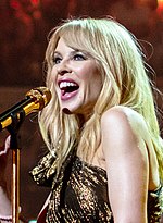 Kylie Minogue at The Queen's Birthday Party (cropped 3).jpg