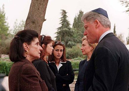 U.S. President Bill Clinton wearing a kippah to visit the grave of Yitzhak Rabin on Mount Herzl.