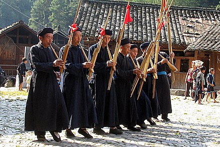 Miao musicians playing free-reed instruments in Guizhou