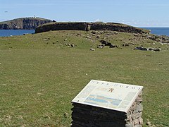 Ness of Burgi fort Iron Age blockhouse at the Ness of Burgi. Sumburgh Head lighthouse in the distance