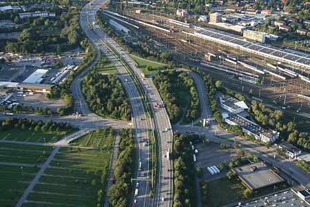 Aerial view from the South: Bundesautobahn 7 crosses the rail tracks at Stellingen station (top); Altona Volkspark, Imtech Arena and O2 World to the left (not on photo)