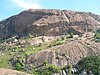 Ramdevarabetta hill. The rectangular cutout holes above the ridge at the middle are cave entrances made for the filming of Passage to India, near Ramanagara